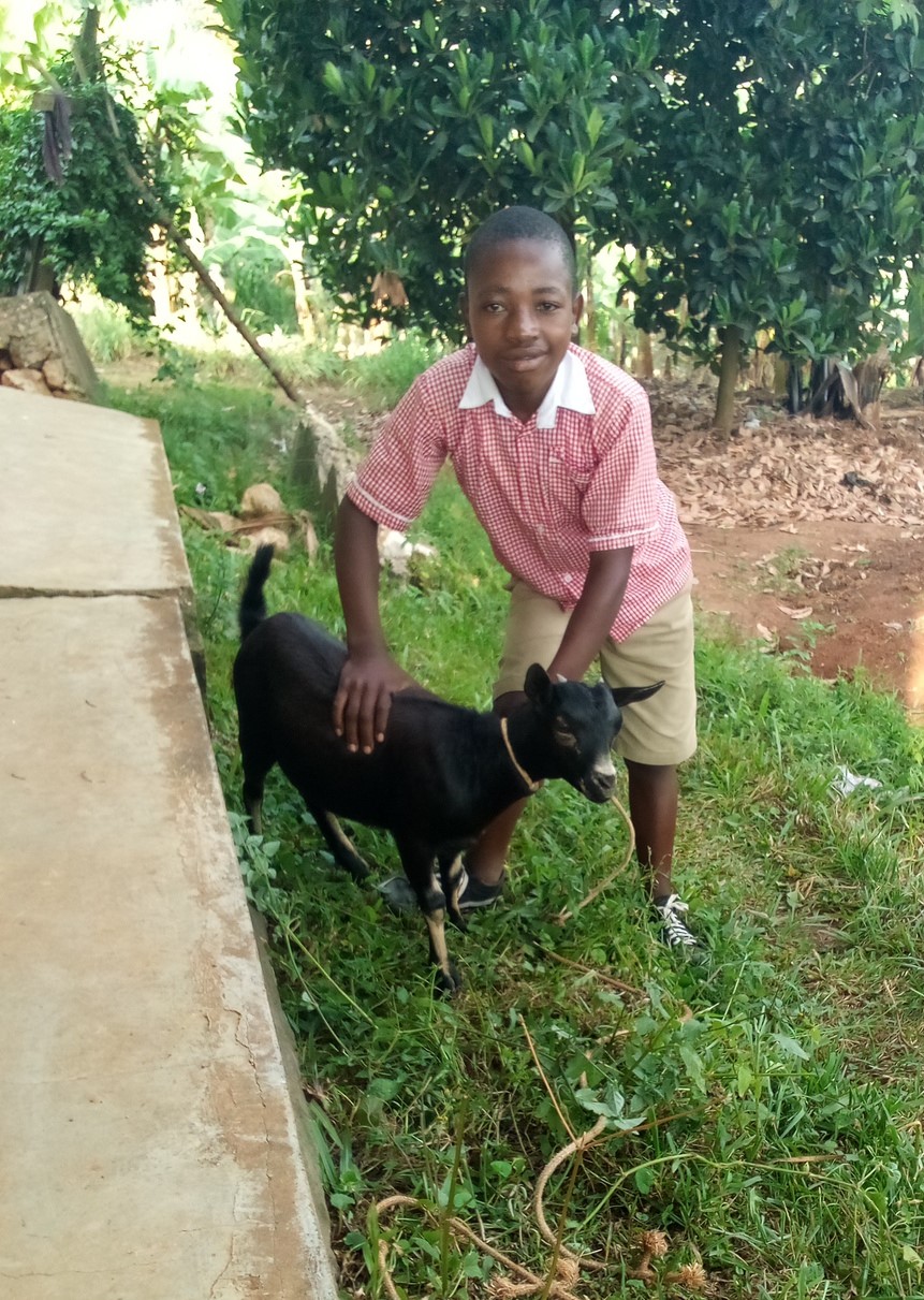 f153_patrick_with_his_gift_of_a goat 2.jpg