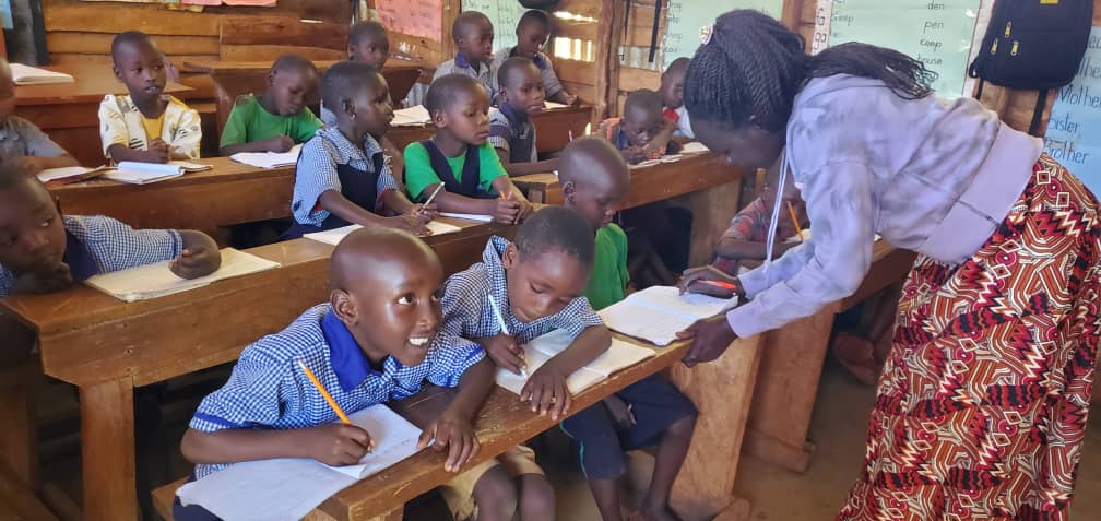 P1 Elizabeth helping students.jpg