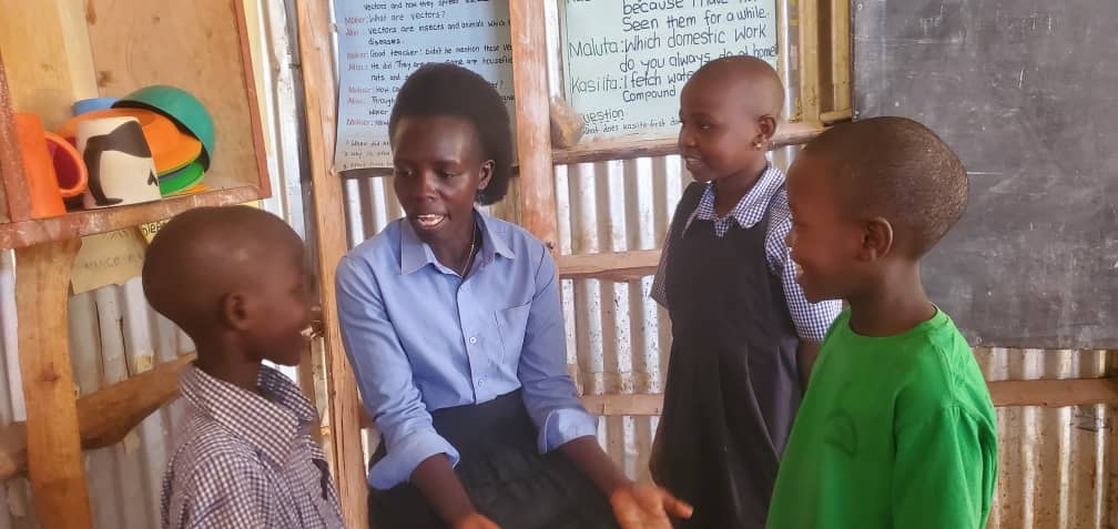 P3 Sarah and 3 students.jpg
