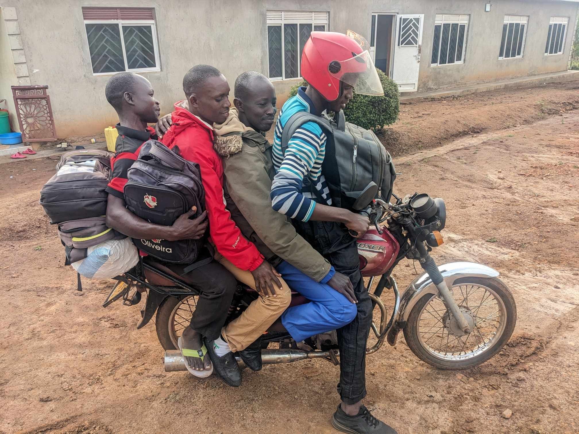 Joseph on a Boda Boda with classmates