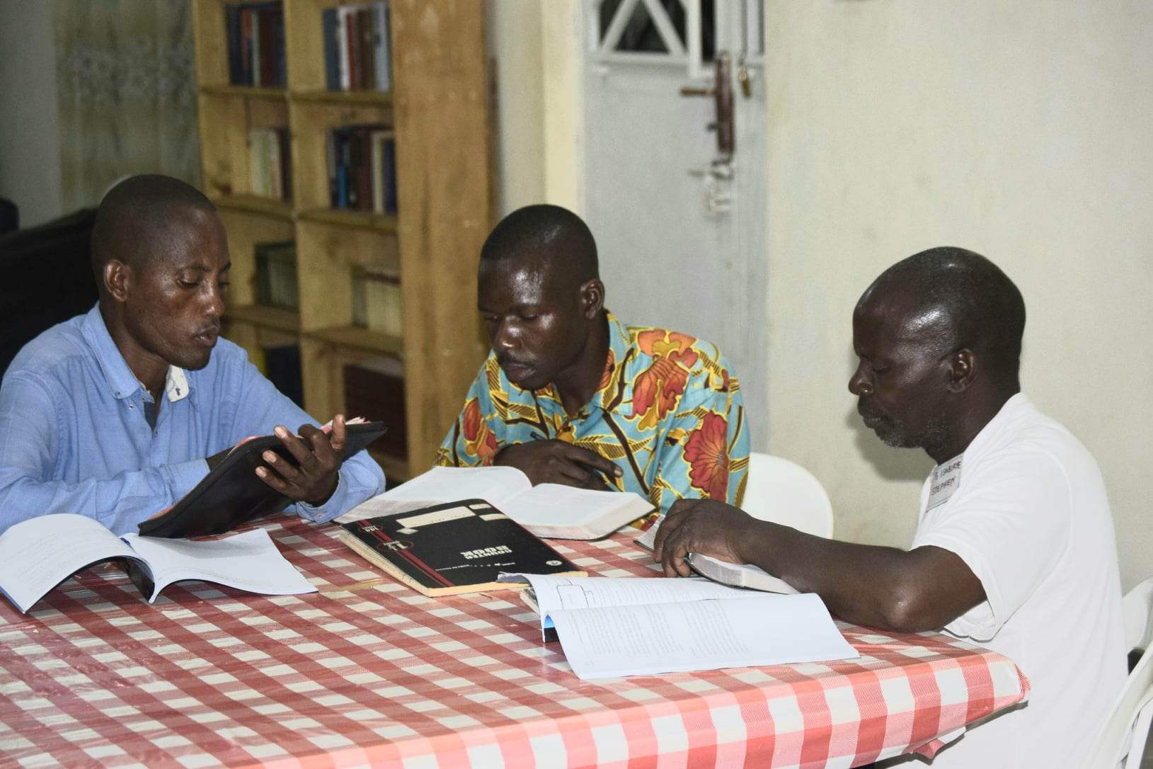Peter Studying His Bible with Classmates